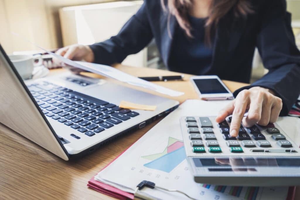 Businessman working on accounting at his office desk