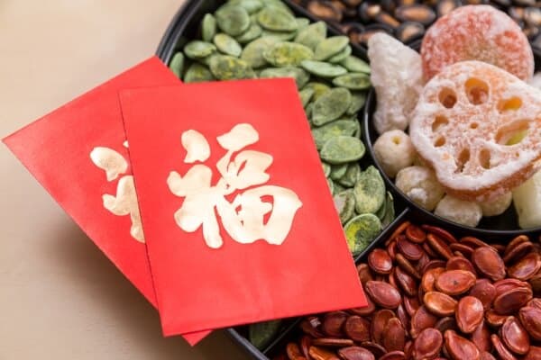 Red envelopes are considered symbols of good luck and money.